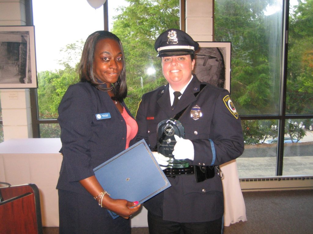 Officer Kelley Tobyne receives the 2015 "Spirit of MAWLE" Award for Community Service.