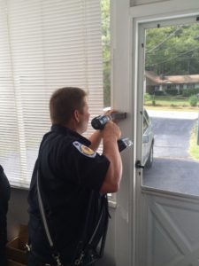 Firefighter Eric Wendel installs the first residential lock box in Georgetown. (Courtesy Photo)