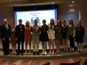 Teachers Michael Noone and Suzanne Troy alongside award-winning students James Talbot, Holly Moore, Lucien Carbonneau, Isabel Castro, Emma Bates, Helen Burtnett, Lauren Reilly, and fellow teachers Michelle Stepper and Denise Wagstaff at the Global Education in Melrose Celebration. (Courtesy Photo Melrose Public Schools)