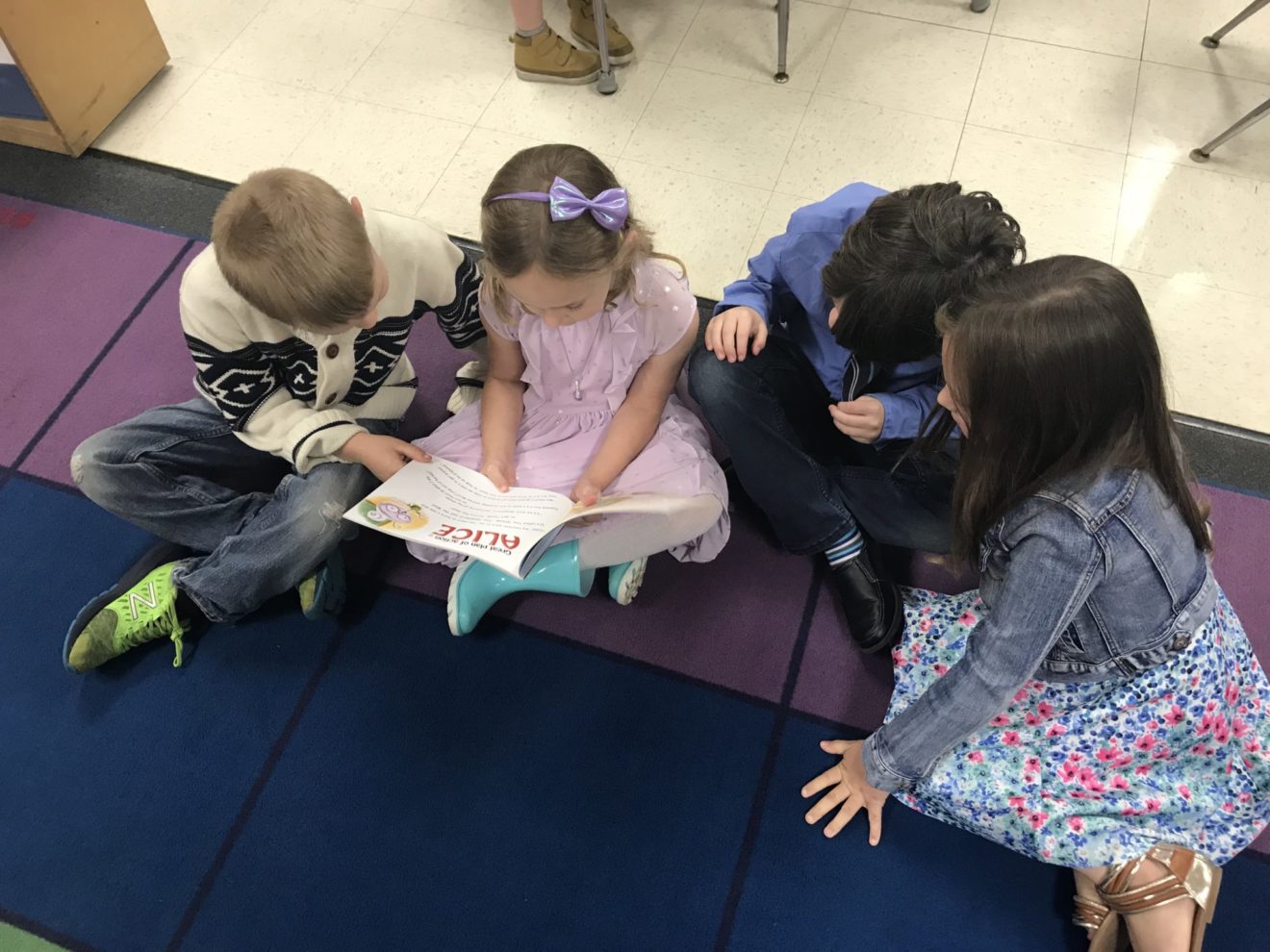 In perhaps the most telling representation of the requirements of the modern world, kindergartners from Rockland's Jefferson Elementary School read the book, "I'm Not Scared, I'm Prepared," an ALICE training book for children by Julia Cook. From left to right: Cillian O'Connor, Lily Kopycinski, Logan Cummins, and Paige Morse from Denise Creedon's Kindergarten class. (Courtesy Photo Rockland Public Schools)