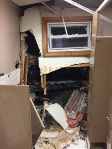 A view of the interior damage with the truck's grille visible in black. (Dracut Police Department/Courtesy Photo)