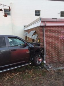A Ram 1500 crashed into the Dracut DPW building on Saturday, causing extensive damage to the structure. (Dracut Police Department/Courtesy Photo)