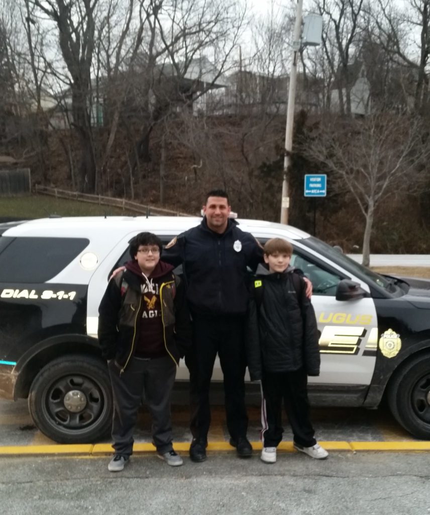 Pictured below, left to right, are Devon Burke, Officer Lorenzo Internicola and Logan Rau. (Courtesy Photo)