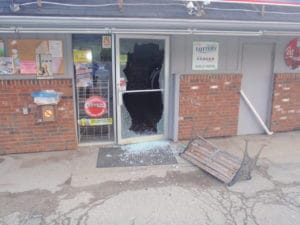 The glass front door was smashed and merchandise inside the store was stolen. (Newport Police Courtesy Photo)