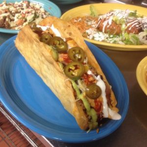 Methuen Police Officers will attempt to eat a Taco Gigante, weighing two pounds and measuring 12 inches long, at a fundraiser this weekend. The Taco Gigante is available at Margaritas Mexican Restaurant for a limited time. (Photo courtesy of Margaritas Mexican Restaurant)