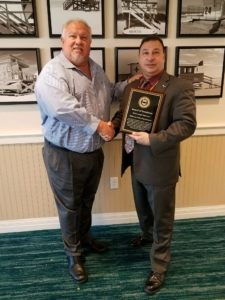 Curtis Lavarello, Director of the School Safety Advocacy Council (left) presents Methuen Police Chief Joseph Solomon with an award recognizing the Methuen Police Department's work in sharing its expertise on the topic of school safety and security. (Courtesy Photo)