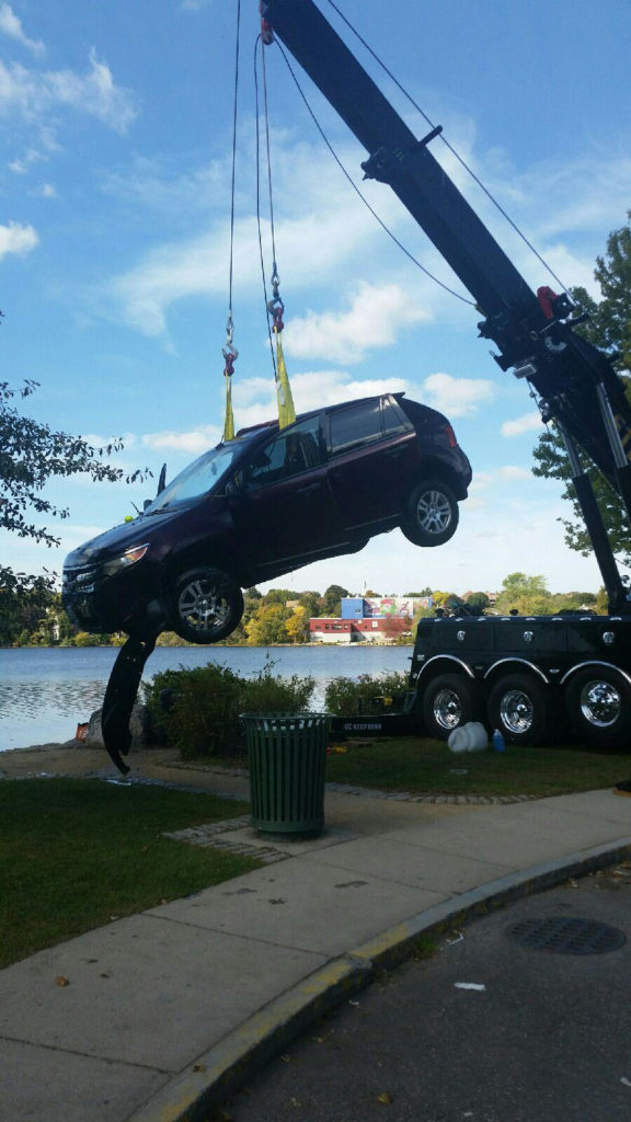 Arlington Police pull a Ford Edge SUV out of the water after it was driven into Spy Pond yesterday afternoon. (Courtesy Photo)