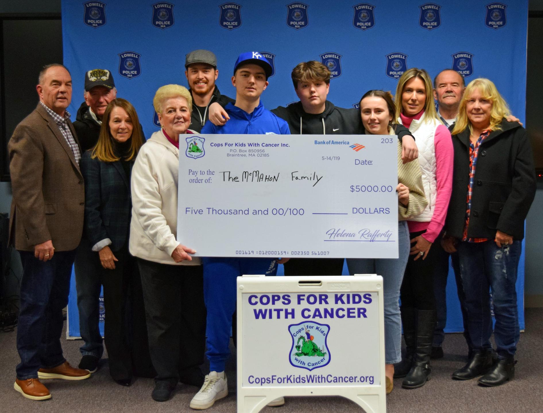 Lowell Police Department and Cops for Kids with Cancer Present Check to