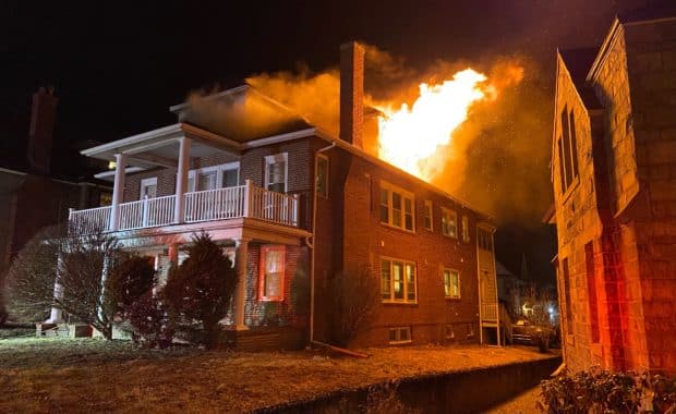Flames shoot out of window of home on fire